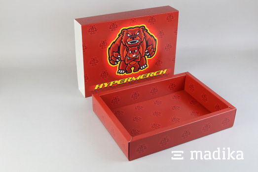 Schiebeschachtel mit Hohlwand und roter, auffälliger Bedruckung. Schiebeschachtel mit Hohlwand und roter, auffälliger Bedruckung