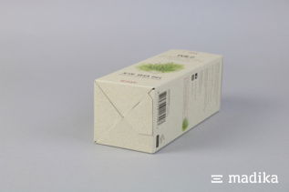 Faltschachtel aus Graspapier mit Bedruckung. Liegende Faltschachtel aus Graspapier
