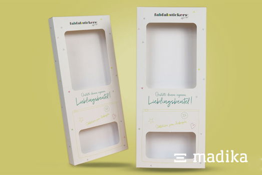 Zwei Faltschachteln mit Sichtfenster und eleganter Bedruckung Zwei Faltschachteln mit Sichtfenster und eleganter Bedruckung