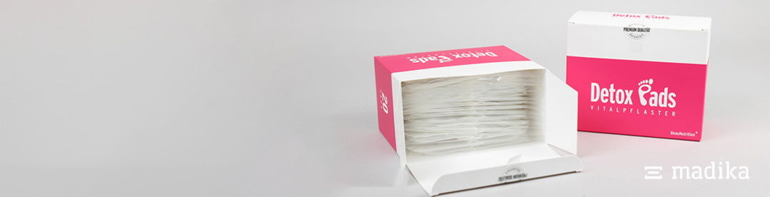 Eine Faltschachtel mit rosa und weißem Design Eine Faltschachtel mit rosa und weißem Design