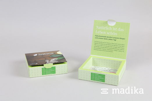 Grüne Klappschachtel mit Hohlwand für Naturkosmetik Eine grüne Klappschachtel mit Hohlwand