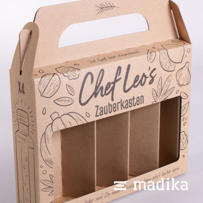 Tragegriffschachtel mit Inlay und Sichtfenster - melden Sie sich gerne für solch eine Kombination bei unseren Kundenbetreuern! Tragegriffschachtel mit Inlay und Sichtfenster