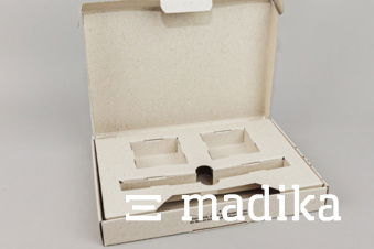 Verpackung aus Graskarton mit individuellem Inlay Verpackung aus Graskarton mit individuellem Inlay