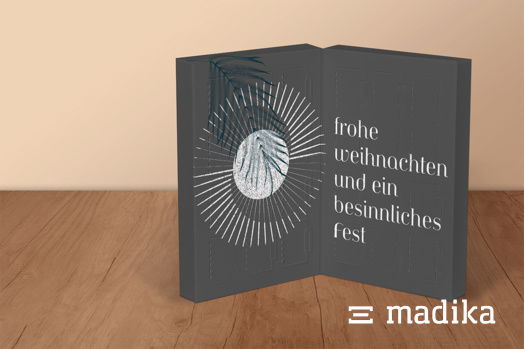 Adventskalender zum Aufklappen aus schwarzem Naturkarton mit weißem Druck Adventskalender zum Aufklappen aus schwarzem Naturkarton mit weißem Druck